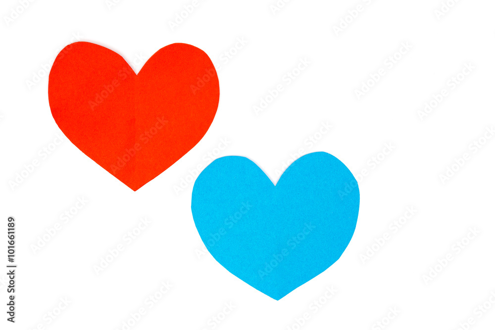 Cut red and blue paper hearts together on white background