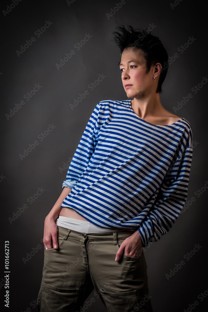 Androgynous character in a striped vest on a gray background Androgynous character in a striped vest on a gray background