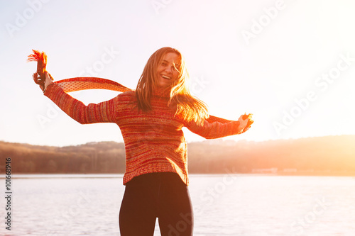 Silhouette of happy teen girl jumping