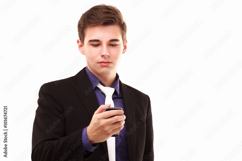 Young businessman seriously looking to the phone Young businessman seriously looking to the phone