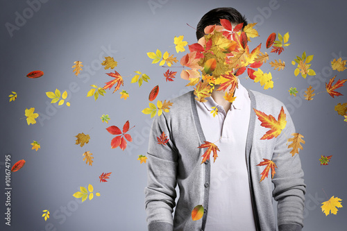 Young man and falling autum...