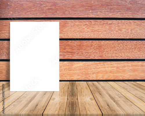 Blank poster leaning at plank wood wall and diagonal wooden floor Mock up for adding your design.