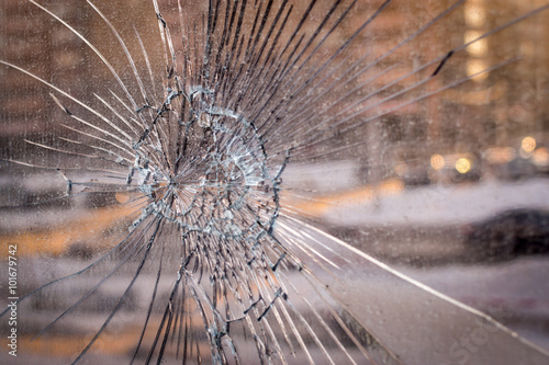 Cracked Broken Glass with City Background