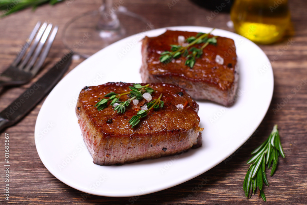 medium roast rib-eye steak with pepper, thyme and salt medium roast rib-eye steak with pepper, thyme and salt