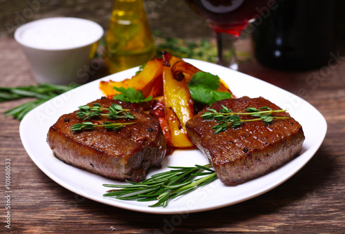 medium roast rib-eye steak with pepper, thyme and salt