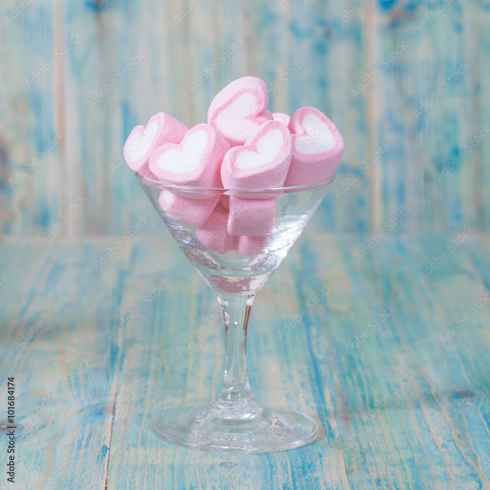 Colorful sweet marshmallow in glasses on table Colorful sweet marshmallow in glasses on table