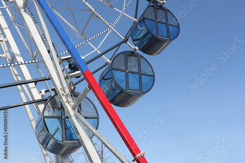 Cabins the ferris wheel against the blue sky © Nataliia Makarova