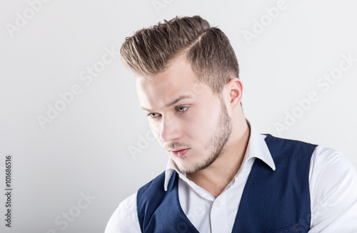 Studio portrait of a fashion young man wearing a suit