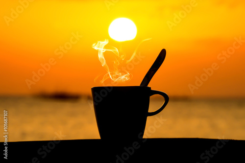 Silhouettes of morning coffee on the lake.