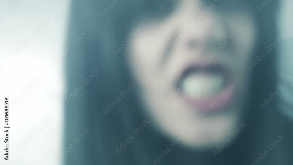 Beautiful woman zombie attacking camera angry