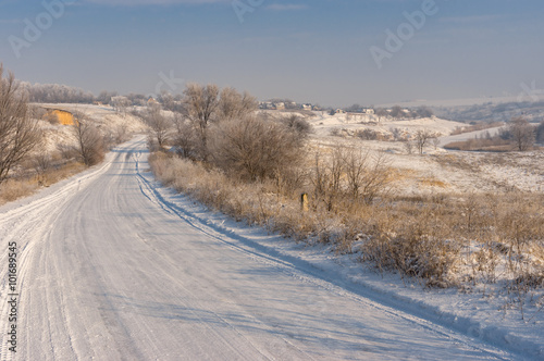 Winter landscape with country road leading to Novo-Nikolaevka village in Dnepropetrovskaya oblast  Ukraine