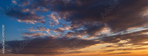 Sunset sky with clouds. Panorama.