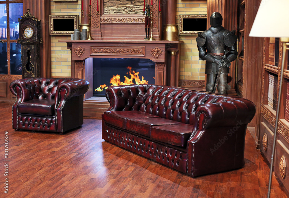 © Anna Baburkina - Classical library room with leather armchair, wooden table and bookcase