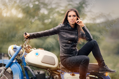 Biker Girl in Leather Jacket on Retro Motorcycle