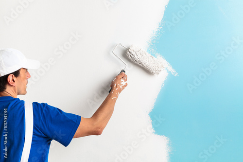 Fototapeta Naklejka Na Ścianę i Meble -  painter painting with paint roller