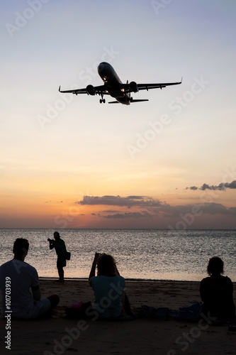 People with plane and color of sunset in twilight