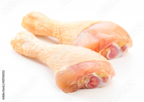 raw chicken drumsticks isolated on white