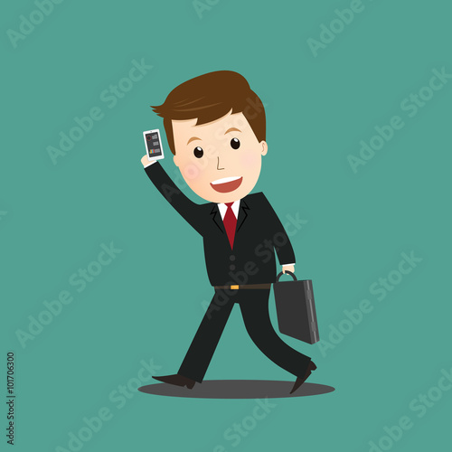 Businessman walking and hold smart phone