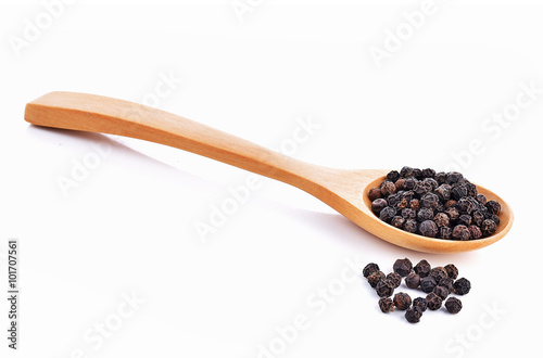 black pepper , spoon on white background