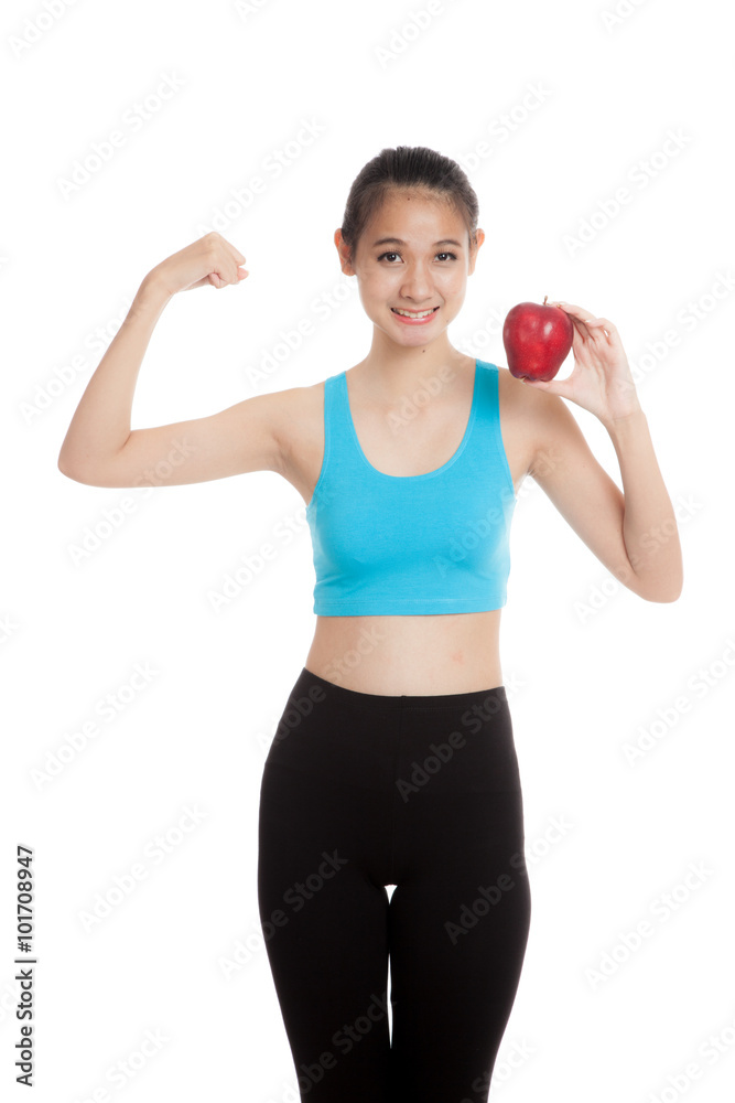Beautiful Asian healthy girl flexing biceps with red apple Beautiful Asian healthy girl flexing biceps with red apple