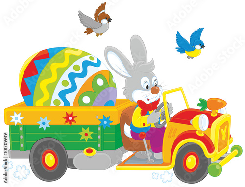 Easter Bunny driving a truck with a big colorfully painted egg