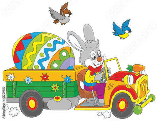 Easter Bunny driving a truck with a big colorfully painted egg