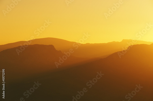 mountain silhouettes at sunset © mimadeo