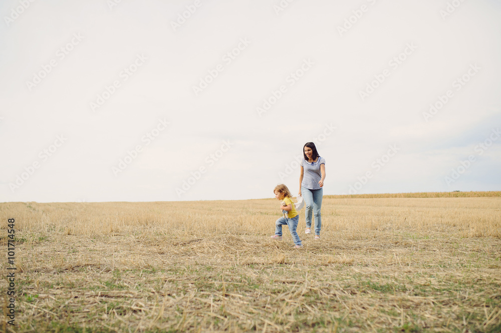 Mother and Daughter in Field