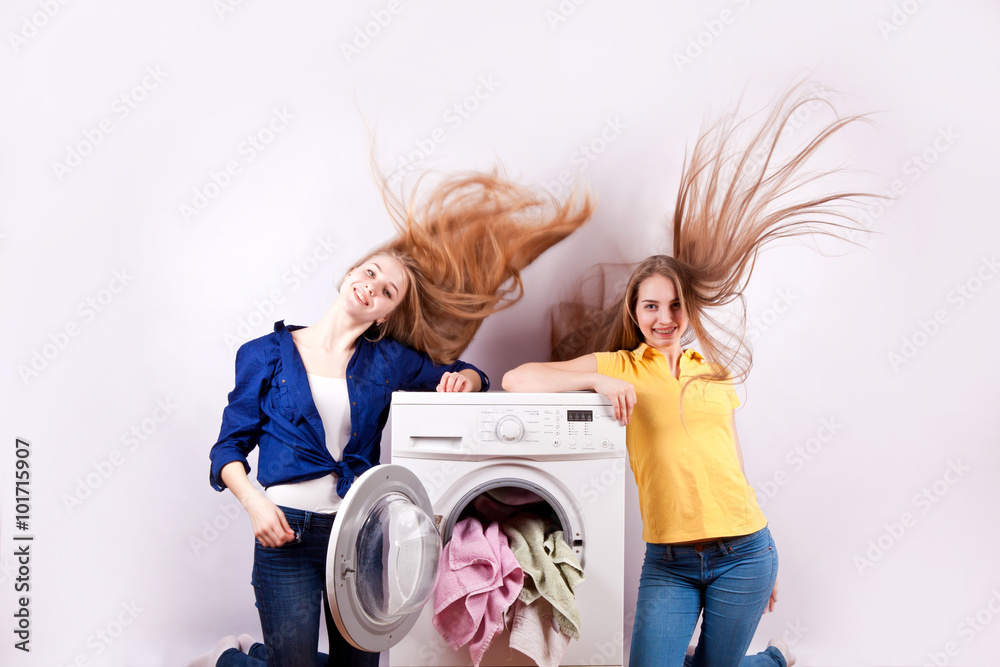 Washer and young girls isolated on white background