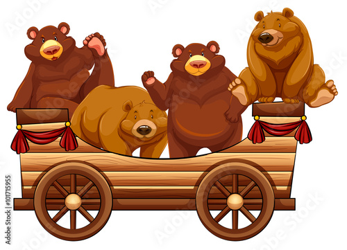 Four bears standing on the wooden wagon