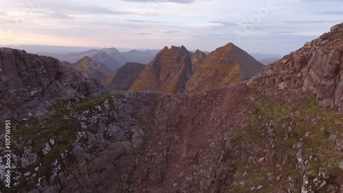 Dramatic aerial shot of An Teallach near Ullapool in the Scottish highlands during sunrise 
