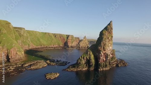 Drone shot of dramatic sea stacks at Duncansby Head near John O' Groats in Scotland
 photo