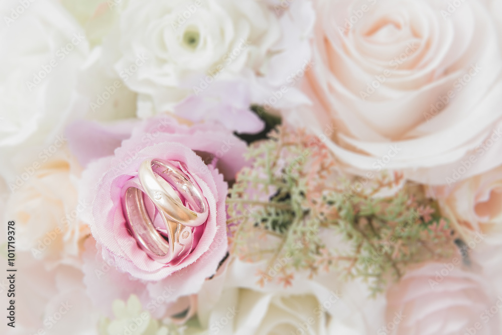 wedding rings on flower bouquet