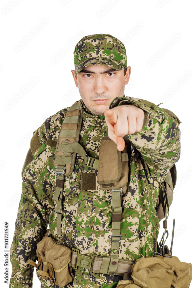 Caucasian Soldier In Green Camouflage Uniform pointing using fin Caucasian Soldier In Green Camouflage Uniform pointing using fin