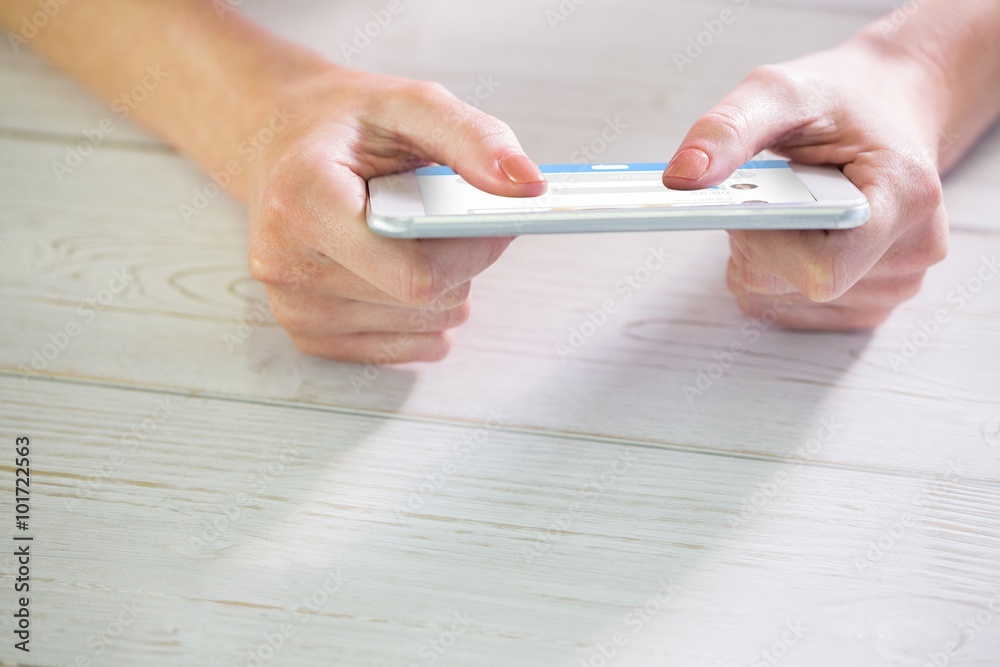 Composite image of woman using smartphone Composite image of woman using smartphone