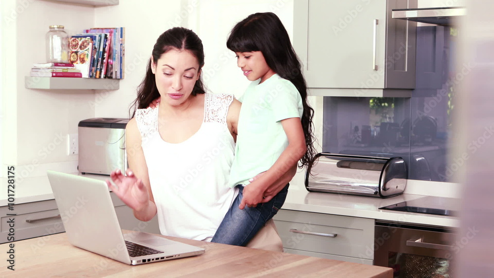 Mother and her daughter using laptop Mother and her daughter using laptop