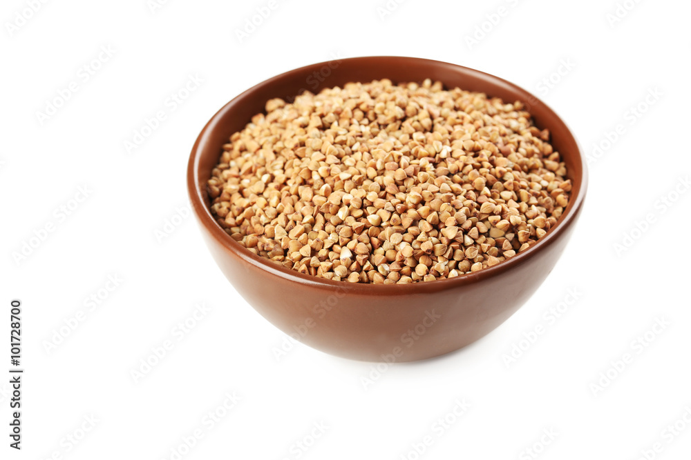 Buckwheat seeds in bowl on a white background Buckwheat seeds in bowl on a white background