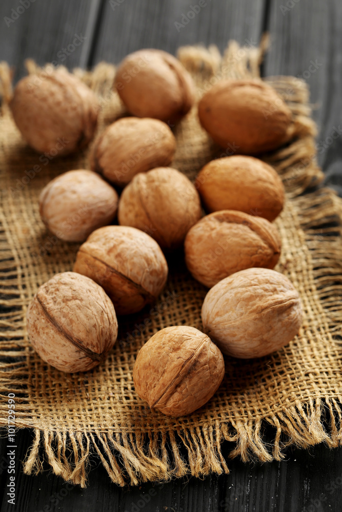 Walnuts on a black wooden table Walnuts on a black wooden table