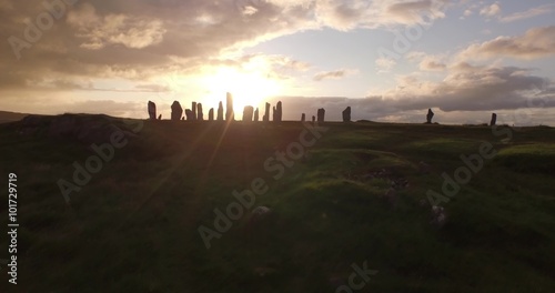 Cinematic aerial shot of Callanish standing stones on the Isle of Lewis, Outer Hebrides, Scotland
 photo