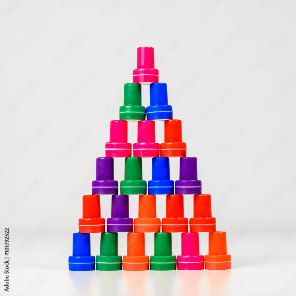 Colorful blocks stacked as pyramid. Isolated on white background. Colorful blocks stacked as pyramid. Isolated on white background.