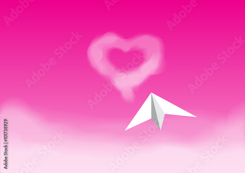 Paper plane flying in the pink sky