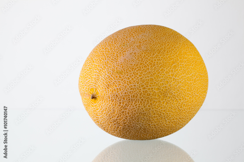 Galia melon on the glass desk Galia melon on the glass desk
