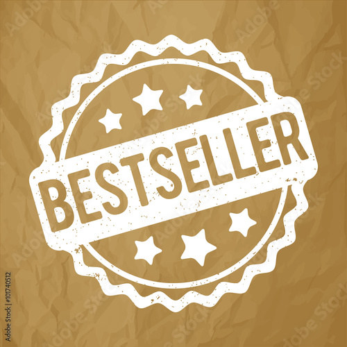 Bestseller rubber stamp white on a crumpled paper brown background.