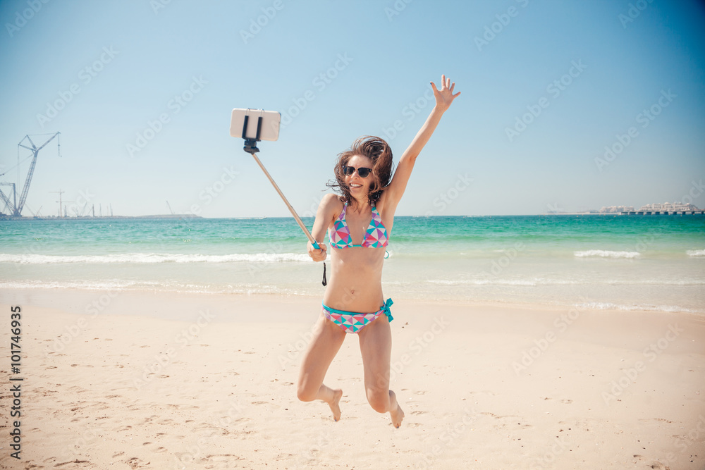 Cheerful Female Taking Selfie At The Seashore