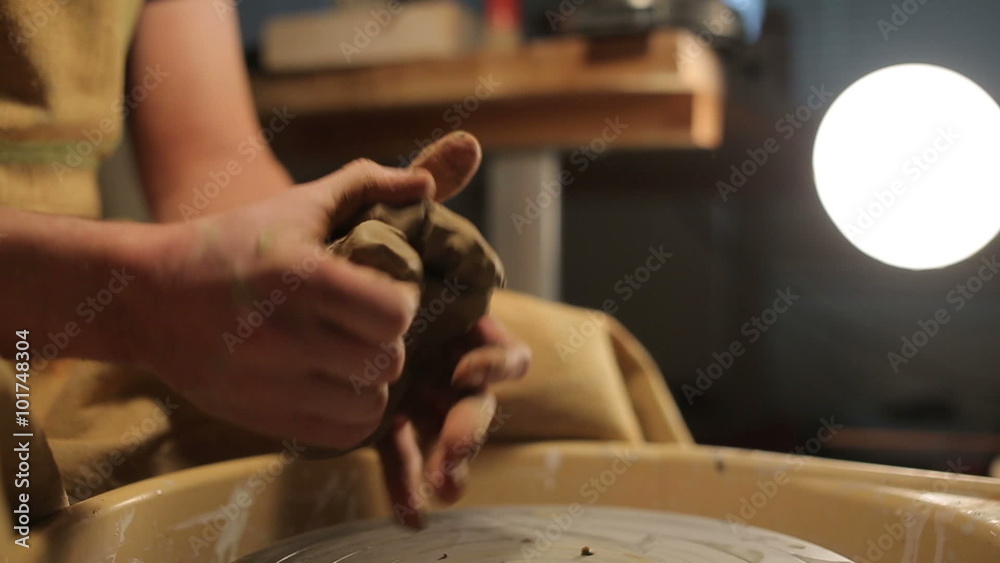 hands of a potter, creating an earthen jar on the circle hands of a potter, creating an earthen jar on the circle