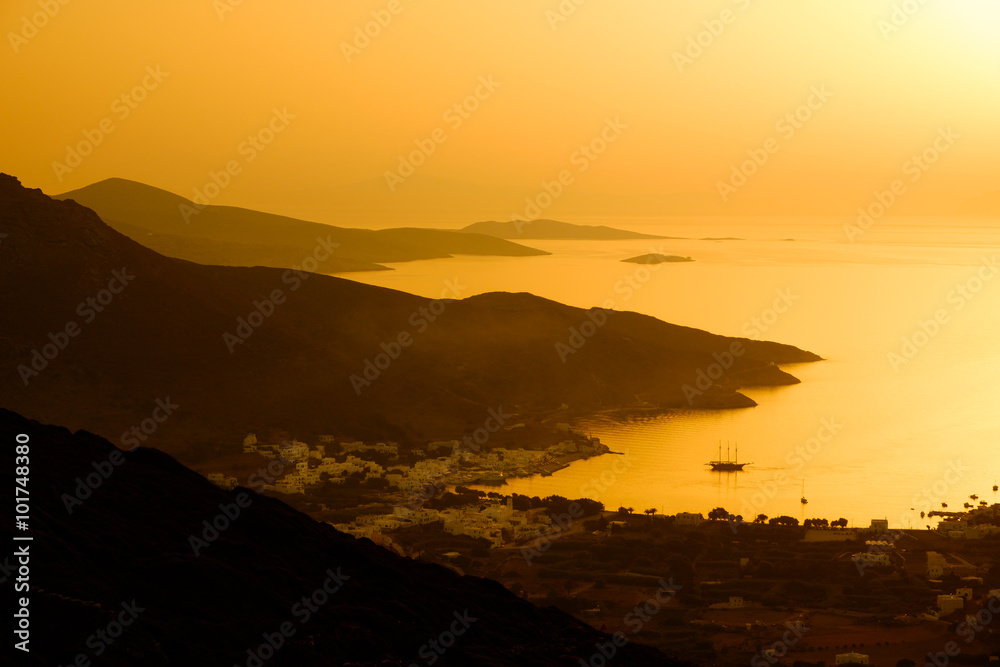 Landscape view of dramatic ocean coastline and port at sunset Landscape view of dramatic ocean coastline and port at sunset