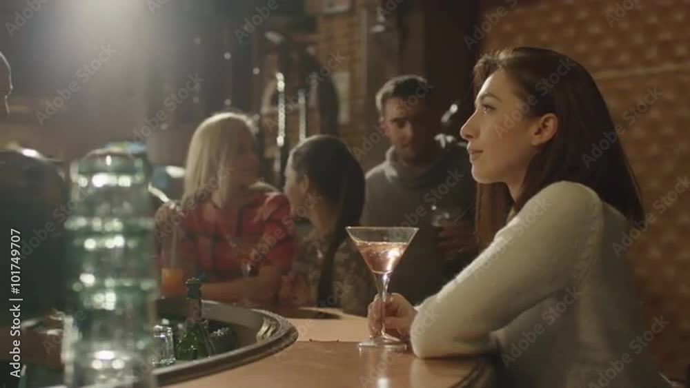 Attractive man walked to a lonely girl in bar in order to meet and started a conversation. Shot on RED Cinema Camera.