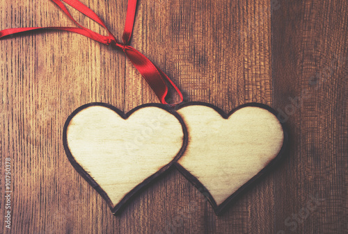 Two woods handmande heart over wood. Valentines day background. photo