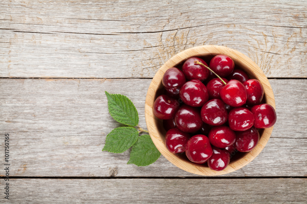 Ripe cherries on wooden table Ripe cherries on wooden table