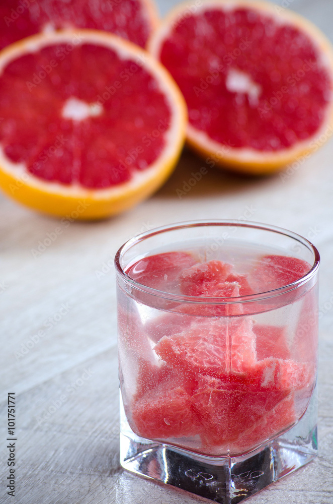 A glass of refreshing drink with grapefruit and grapefruit A glass of refreshing drink with grapefruit and grapefruit